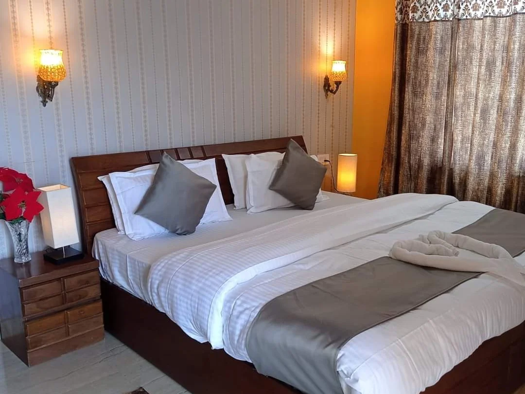 Hotel Himalayan View - Bedroom Interior with 2 Single Beds & Ambient Bedside Lamps