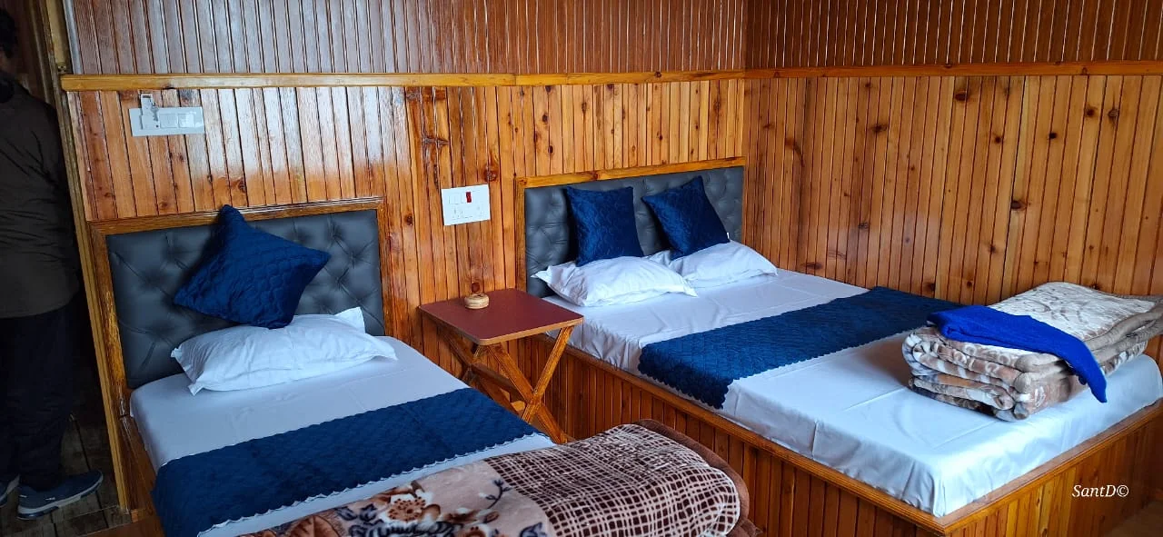 Kolakham Nature View Home Stay - Spacious Family Bedroom with Double and Single Beds