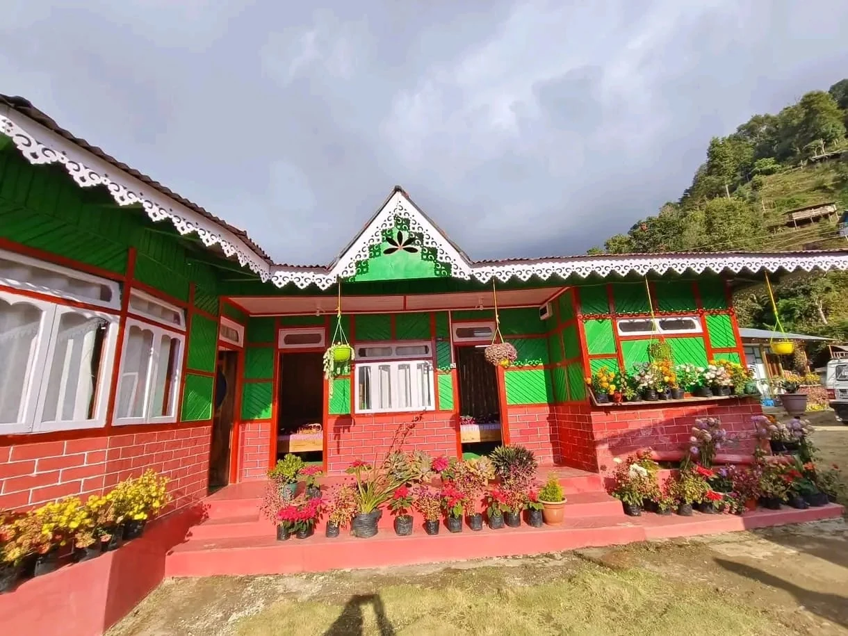 Lungsu Kanchan View Homestay - Traditional Cottage Facade with Floral Veranda