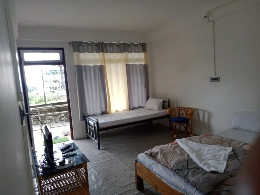 Rishabh Rich Homestay - Spacious Deluxe Bedroom with Balcony