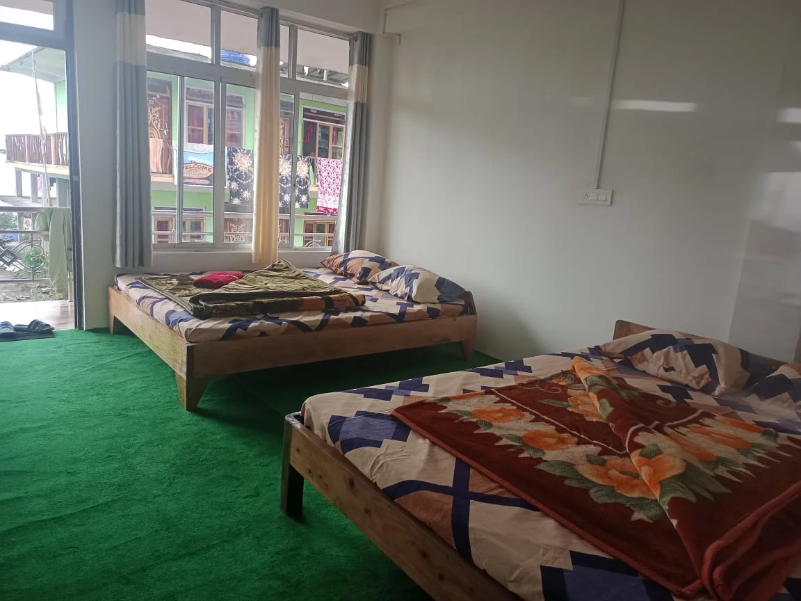 Rishabh Rich Homestay - Green Carpeted Family Bedroom with Double Beds